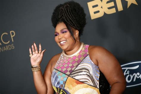 Lizzo's Bantu Knots and Bedazzled Gucci Barrette 